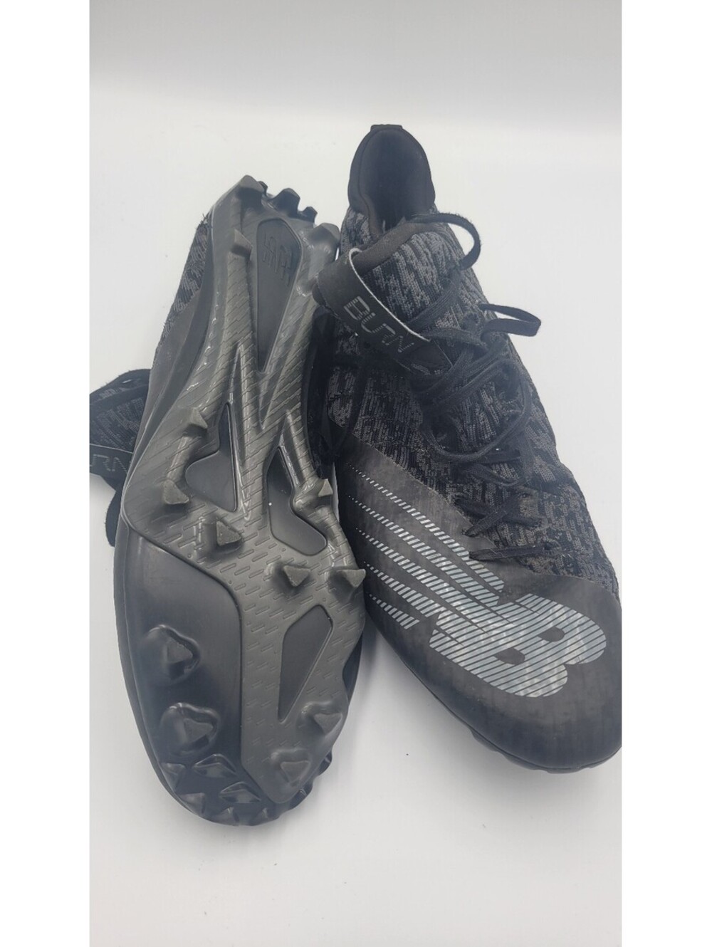 New Balance black cleats